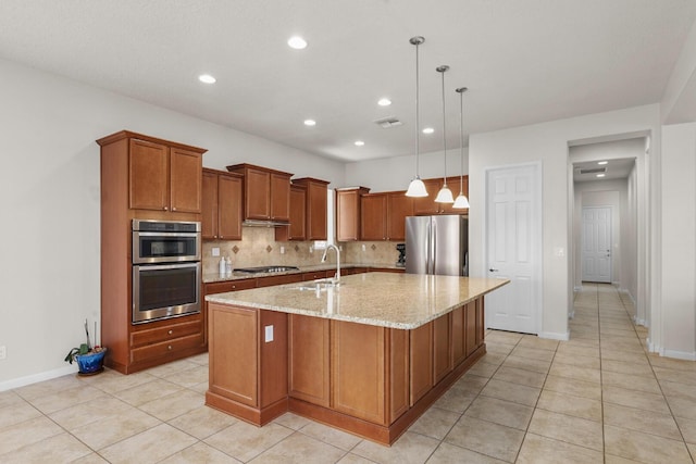 729 Sierra Verde Way NE, Rio Rancho, NM 87124 - kitchen featuring stainless steel appliances, brown cabinetry, a sink, light tile patterned floors, and a large island