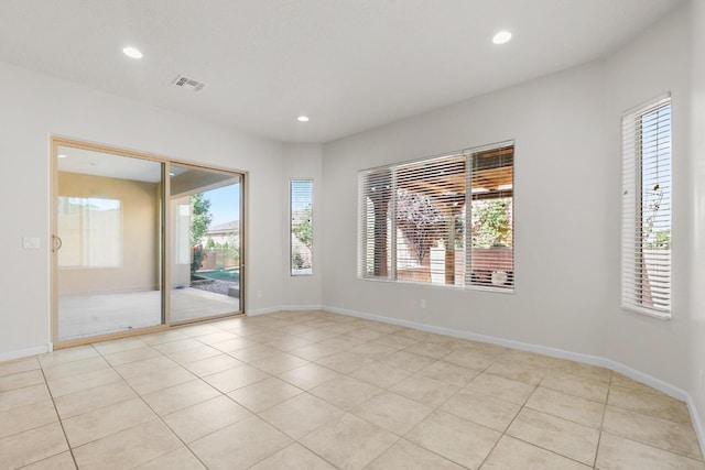 729 Sierra Verde Way NE, Rio Rancho, NM 87124 - empty room with plenty of natural light, recessed lighting, light tile patterned floors, and baseboards