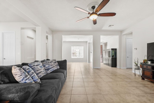 729 Sierra Verde Way NE, Rio Rancho, NM 87124 - living room with a ceiling fan, light tile patterned floors, and baseboards