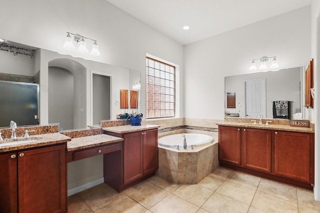 729 Sierra Verde Way NE, Rio Rancho, NM 87124 - full bathroom with tile patterned floors, a stall shower, a bath, and two vanities