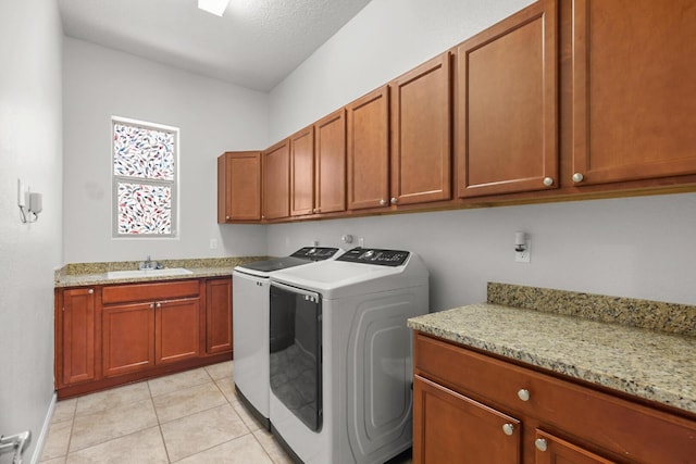729 Sierra Verde Way NE, Rio Rancho, NM 87124 - laundry room with cabinet space, washing machine and clothes dryer, light tile patterned flooring, and baseboards