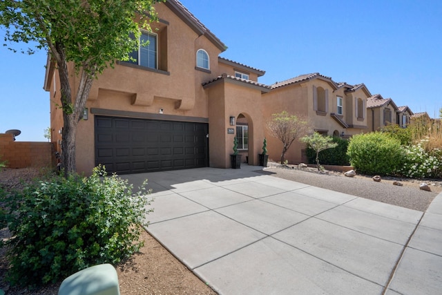 3604 Plano Vista Rd NE, Rio Rancho, NM 87124 - mediterranean / spanish-style house featuring stucco siding, a garage, concrete driveway, and a tile roof