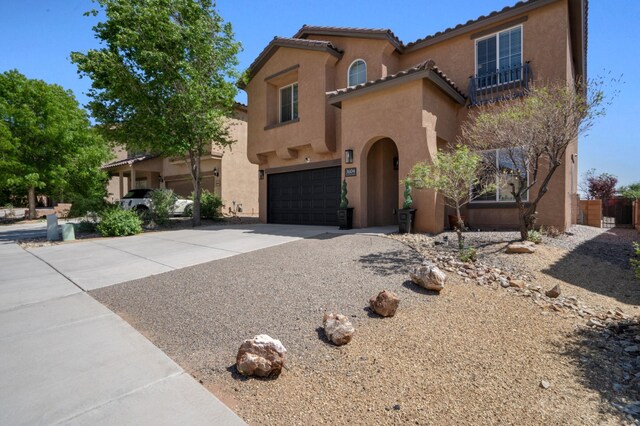 3604 Plano Vista Rd NE, Rio Rancho, NM 87124 - mediterranean / spanish-style house featuring stucco siding, concrete driveway, a garage, and a tiled roof