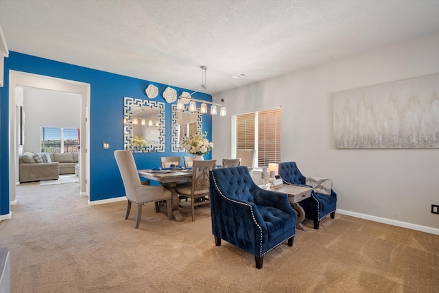 3604 Plano Vista Rd NE, Rio Rancho, NM 87124 - dining area with carpet flooring, baseboards, and a textured ceiling
