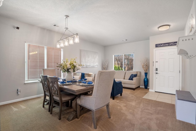 3604 Plano Vista Rd NE, Rio Rancho, NM 87124 - dining area featuring light colored carpet, baseboards, a textured ceiling, and light tile patterned floors
