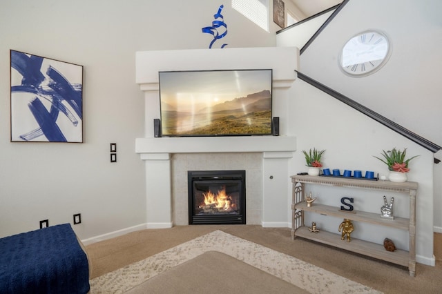 3604 Plano Vista Rd NE, Rio Rancho, NM 87124 - carpeted living room with a tiled fireplace and baseboards