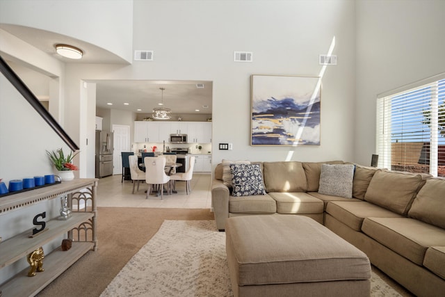 3604 Plano Vista Rd NE, Rio Rancho, NM 87124 - living room with a high ceiling, recessed lighting, and light tile patterned floors