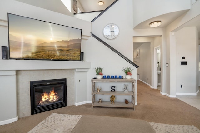 3604 Plano Vista Rd NE, Rio Rancho, NM 87124 - carpeted living room featuring a fireplace and baseboards
