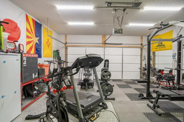 3604 Plano Vista Rd NE, Rio Rancho, NM 87124 - workout area featuring a textured ceiling and a garage