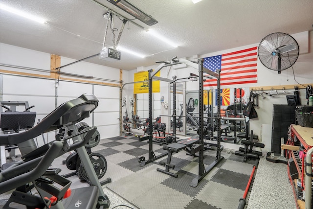 3604 Plano Vista Rd NE, Rio Rancho, NM 87124 - gym featuring a textured ceiling and a garage