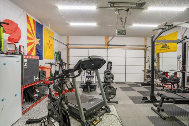 3604 Plano Vista Rd NE, Rio Rancho, NM 87124 - workout area with a textured ceiling and a garage