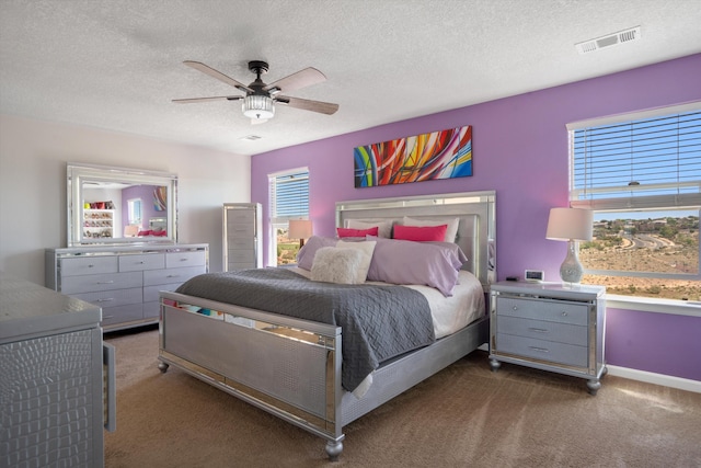 3604 Plano Vista Rd NE, Rio Rancho, NM 87124 - carpeted bedroom featuring ceiling fan, a textured ceiling, and baseboards