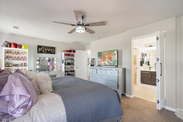 3604 Plano Vista Rd NE, Rio Rancho, NM 87124 - bedroom featuring carpet floors, connected bathroom, a textured ceiling, a ceiling fan, and baseboards