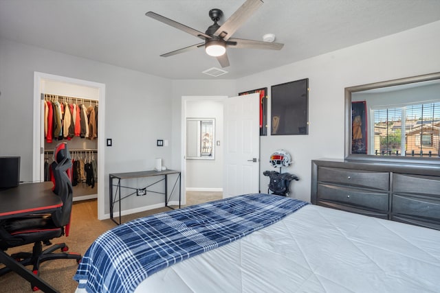 3604 Plano Vista Rd NE, Rio Rancho, NM 87124 - bedroom with carpet flooring, a walk in closet, baseboards, a desk, and a closet