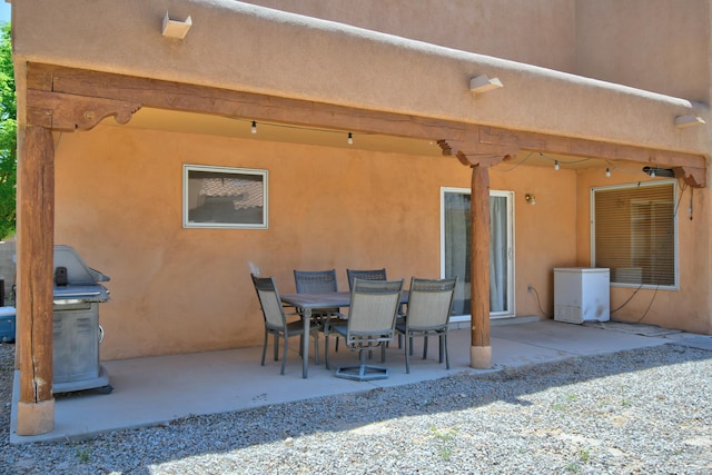view of patio featuring a grill