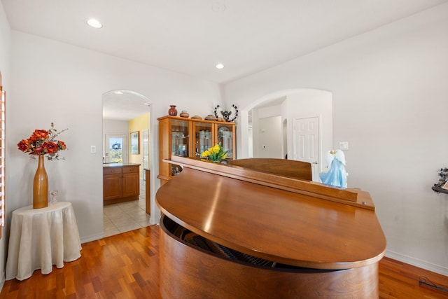 3916 Alamogordo Dr NW, Albuquerque, NM 87120 - interior space with arched walkways, light wood-type flooring, baseboards, and recessed lighting
