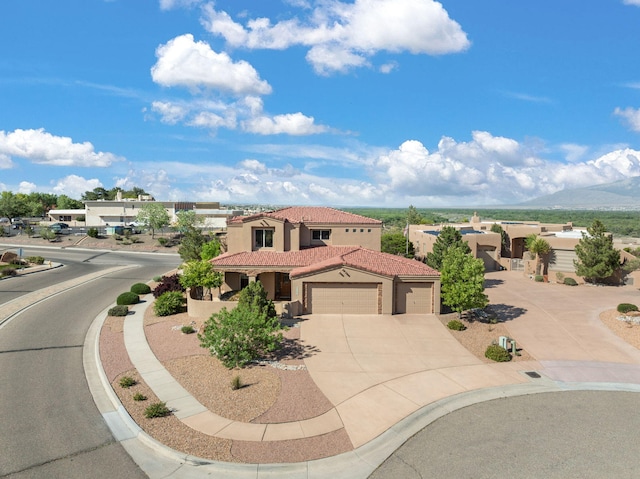 3916 Alamogordo Dr NW, Albuquerque, NM 87120 - view of front of house featuring a garage, stucco siding, concrete driveway, and a tiled roof