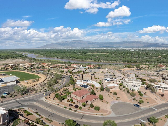 3916 Alamogordo Dr NW, Albuquerque, NM 87120 - aerial perspective of suburban area with a water and mountain view