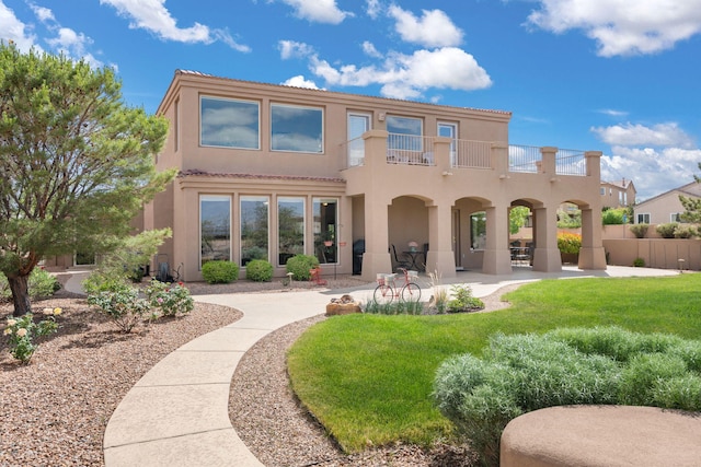3916 Alamogordo Dr NW, Albuquerque, NM 87120 - rear view of house with a balcony, stucco siding, a tiled roof, and a patio