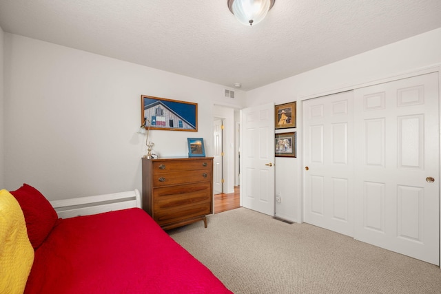 3916 Alamogordo Dr NW, Albuquerque, NM 87120 - carpeted bedroom with a textured ceiling, a closet, and baseboards