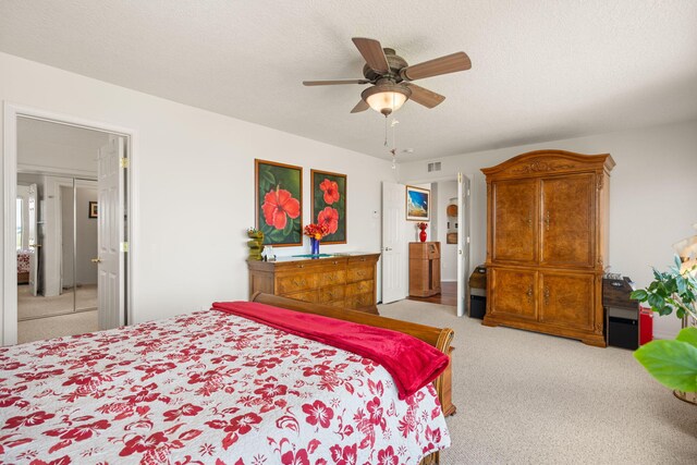 3916 Alamogordo Dr NW, Albuquerque, NM 87120 - bedroom with light carpet, ceiling fan, and a textured ceiling