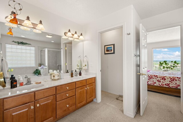 3916 Alamogordo Dr NW, Albuquerque, NM 87120 - bathroom with a shower stall, double vanity, ensuite bathroom, and healthy amount of natural light