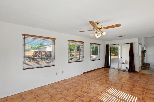 1595 W Bosque Loop, Bosque Farms, NM 87068 - unfurnished room with a ceiling fan and baseboards