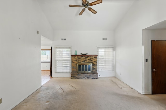 1595 W Bosque Loop, Bosque Farms, NM 87068 - unfurnished living room featuring ceiling fan, carpet flooring, high vaulted ceiling, and a brick fireplace