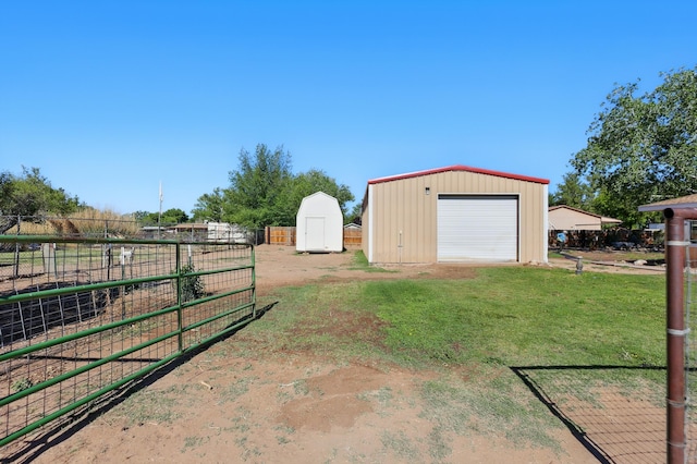 1595 W Bosque Loop, Bosque Farms, NM 87068 - view of yard featuring an outbuilding, a detached garage, and driveway