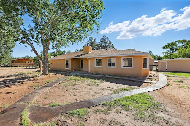 1595 W Bosque Loop, Bosque Farms, NM 87068 - view of front of property with stucco siding and a chimney