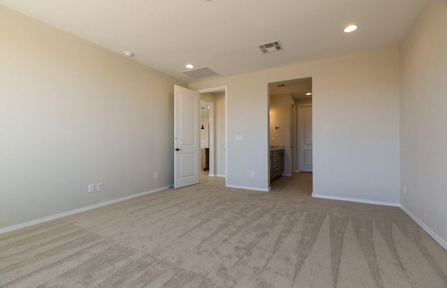 8328 Bronte Ln NW, Albuquerque, NM 87120 - unfurnished bedroom featuring light colored carpet, recessed lighting, baseboards, and ensuite bathroom