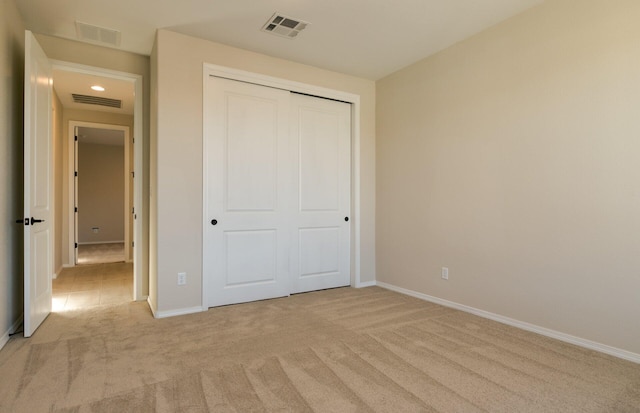 8328 Bronte Ln NW, Albuquerque, NM 87120 - unfurnished bedroom featuring light colored carpet, baseboards, and a closet