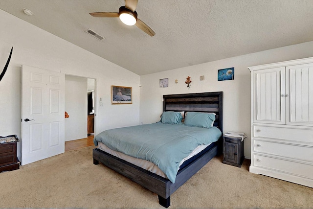 1250 Carnival Ave NW, Los Lunas, NM 87031 - bedroom featuring lofted ceiling, light colored carpet, ceiling fan, and a textured ceiling