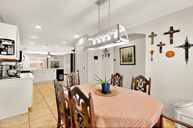 1250 Carnival Ave NW, Los Lunas, NM 87031 - dining room with light tile patterned floors, a ceiling fan, and recessed lighting