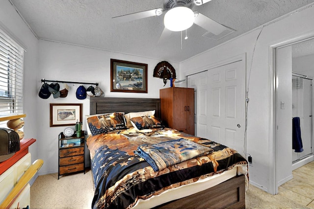 1250 Carnival Ave NW, Los Lunas, NM 87031 - bedroom featuring a textured ceiling, a closet, ceiling fan, and baseboards