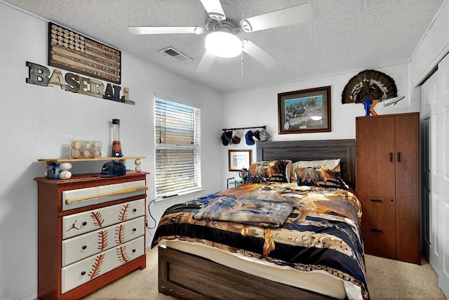 1250 Carnival Ave NW, Los Lunas, NM 87031 - bedroom featuring a textured ceiling and ceiling fan