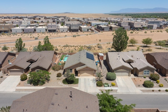 1250 Carnival Ave NW, Los Lunas, NM 87031 - aerial view of residential area featuring a mountainous background