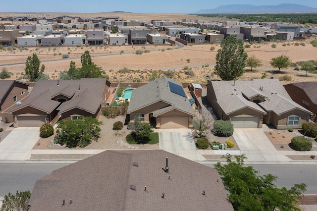 1250 Carnival Ave NW, Los Lunas, NM 87031 - aerial perspective of suburban area with a mountain backdrop