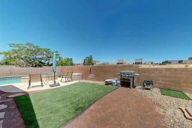 1250 Carnival Ave NW, Los Lunas, NM 87031 - view of yard featuring a patio area