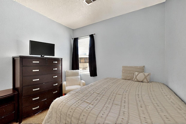 1321 Elkslip Dr NE, Rio Rancho, NM 87144 - bedroom featuring a textured ceiling and carpet