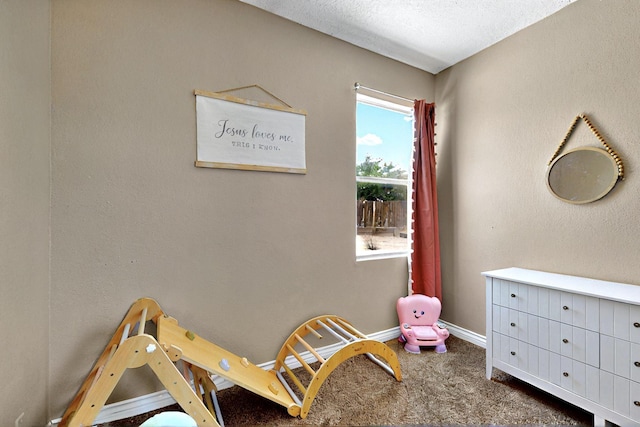 1321 Elkslip Dr NE, Rio Rancho, NM 87144 - playroom with carpet flooring and baseboards