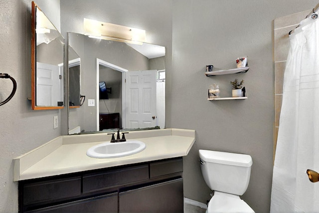 1321 Elkslip Dr NE, Rio Rancho, NM 87144 - bathroom featuring vanity, toilet, and a shower with shower curtain