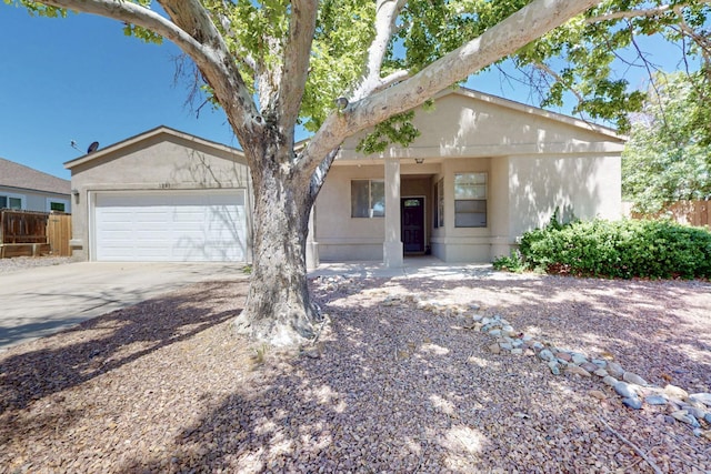 1321 Elkslip Dr NE, Rio Rancho, NM 87144 - single story home featuring fence, concrete driveway, stucco siding, and an attached garage
