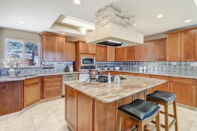 1106 Warm Sands Dr SE, Albuquerque, NM 87123 - kitchen featuring a sink, stainless steel appliances, brown cabinetry, a kitchen island, and light tile patterned flooring