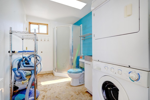 1106 Warm Sands Dr SE, Albuquerque, NM 87123 - full bathroom featuring stacked washer / drying machine, a stall shower, and toilet