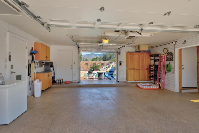 1106 Warm Sands Dr SE, Albuquerque, NM 87123 - garage with a mountain view and a garage door opener