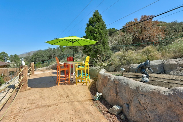 1106 Warm Sands Dr SE, Albuquerque, NM 87123 - view of yard featuring a patio area and a mountain view