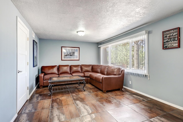 1106 Warm Sands Dr SE, Albuquerque, NM 87123 - living room featuring baseboards and a textured ceiling