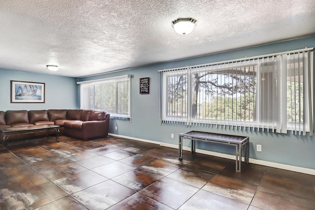 1106 Warm Sands Dr SE, Albuquerque, NM 87123 - living room with a textured ceiling, baseboards, and tile patterned floors