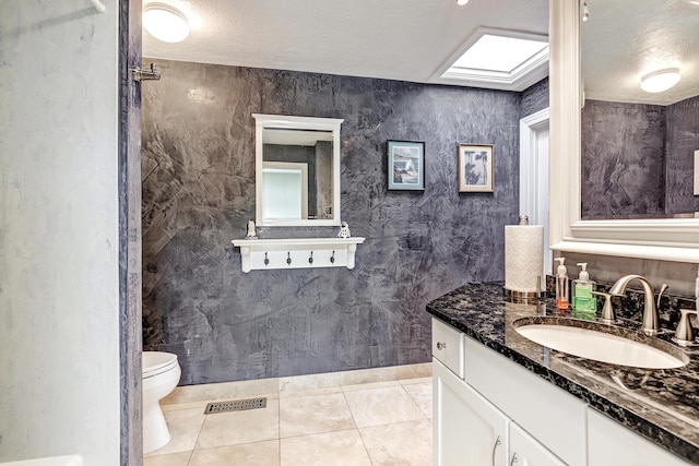 1106 Warm Sands Dr SE, Albuquerque, NM 87123 - bathroom with a sink, toilet, and tile patterned floors